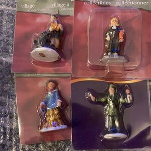 Four Holiday Time village collectibles figurines.